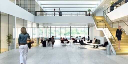 Professional commercial office cleaning service in Toronto sanitizing a modern workspace